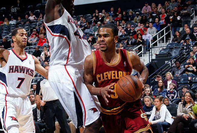 ATLANTA, GA - JANUARY 21:  Ramon Sessions #3 of the Cleveland Cavaliers drives against Jannero Pargo #7 and Ivan Johnson #44 of the Atlanta Hawks at Philips Arena on January 21, 2012 in Atlanta, Georgia.  NOTE TO USER: User expressly acknowledges and agrees that, by downloading and or using this photograph, User is consenting to the terms and conditions of the Getty Images License Agreement.  (Photo by Kevin C. Cox/Getty Images)