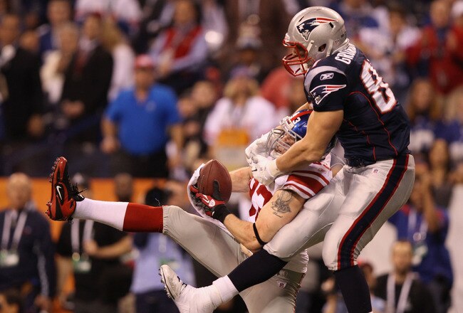 INDIANAPOLIS, IN - FEBRUARY 05:  Chase Blackburn #93 of the New York Giants intercepts a pass intended for Rob Gronkowski #87 of the New England Patriots in the second half during Super Bowl XLVI at Lucas Oil Stadium on February 5, 2012 in Indianapolis, Indiana.  (Photo by Ezra Shaw/Getty Images)