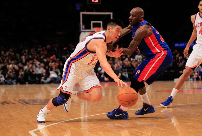NEW YORK, NY - JANUARY 31:  Jeremy Lin #17 of the New York Knicks drives past Detroit Pistons Walker Russell #23 of the Detroit Pistons at Madison Square Garden on January 31, 2012 in New York City.  NOTE TO USER: User expressly acknowledges and agrees that, by downloading and or using this photograph, User is consenting to the terms and conditions of the Getty Images License Agreement. (Photo by Chris Trotman/Getty Images)