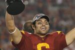 PASADENA, CA - JANUARY 1:  Mark Sanchez #6 of the USC Trojans rejoices as he holds the Rose Bowl Trophy after the game against the Penn State Nittany Lions on January 1, 2009 at the Rose Bowl in Pasadena, California.  USC won 38-24.  (Photo by Jeff Golden/Getty Images)