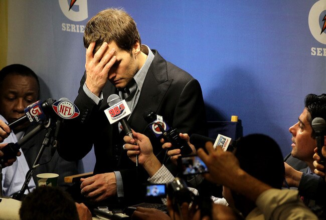 INDIANAPOLIS, IN - FEBRUARY 05:  Quarterback Tom Brady #12 of the New England Patriots speaks to the media after losing to the New York Giants in Super Bowl XLVI at Lucas Oil Stadium on February 5, 2012 in Indianapolis, Indiana. The New York Giants defeated the New England Patriots 21-17.  (Photo by Jamie Squire/Getty Images)