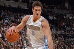 DENVER, CO - JANUARY 13:  Danilo Gallinari #8 of the Denver Nuggets controls the ball against the Miami Heat at the Pepsi Center on January 13, 2012 in Denver, Colorado. The Nuggets defeated the Heat 117-104. NOTE TO USER: User expressly acknowledges and agrees that, by downloading and or using this photograph, User is consenting to the terms and conditions of the Getty Images License Agreement.  (Photo by Doug Pensinger/Getty Images)