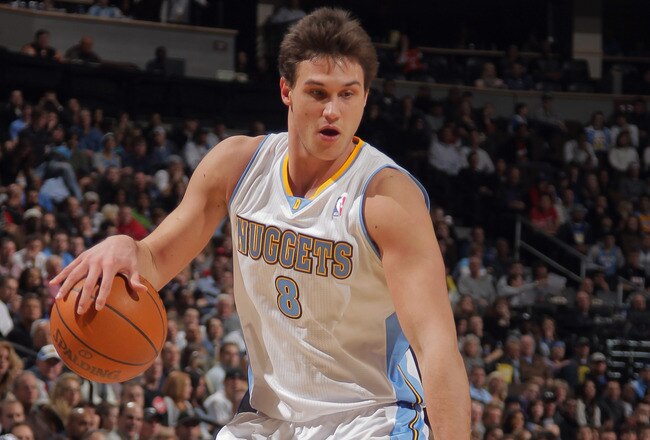 DENVER, CO - JANUARY 13:  Danilo Gallinari #8 of the Denver Nuggets controls the ball against the Miami Heat at the Pepsi Center on January 13, 2012 in Denver, Colorado. The Nuggets defeated the Heat 117-104. NOTE TO USER: User expressly acknowledges and agrees that, by downloading and or using this photograph, User is consenting to the terms and conditions of the Getty Images License Agreement.  (Photo by Doug Pensinger/Getty Images)
