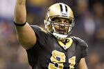 NEW ORLEANS, LA - NOVEMBER 28:   Will Smith #91 of the New Orleans Saints shows who is number one after a game against the New York Giants at Mercedes-Benz Superdome on November 28, 2011 in New Orleans, Louisiana.  The Saints defeated the Giants 49 to 24.  (Photo by Wesley Hitt/Getty Images)