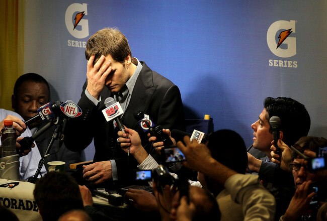 INDIANAPOLIS, IN - FEBRUARY 05:  Quarterback Tom Brady #12 of the New England Patriots speaks to the media after losing to the New York Giants in Super Bowl XLVI at Lucas Oil Stadium on February 5, 2012 in Indianapolis, Indiana. The New York Giants defeated the New England Patriots 21-17.  (Photo by Jamie Squire/Getty Images)