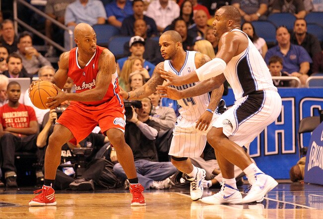 ORLANDO, FL - FEBRUARY 06:  Chauncey Billups #1 of the Los Angeles Clippers is guarded by Glen Davis #11 and Jameer Nelson #14 of the Orlando Magic during the game at Amway Center on February 6, 2012 in Orlando, Florida.   NOTE TO USER: User expressly acknowledges and agrees that, by downloading and or using this Photograph, user is consenting to the terms and conditions of the Getty Images License Agreement.  (Photo by Sam Greenwood/Getty Images)