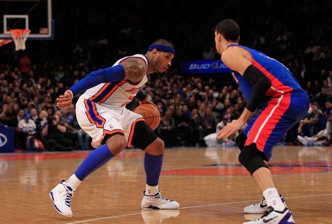 NEW YORK, NY - JANUARY 31:  Carmelo Anthony #7 of the New York Knicks drives against Austin Daye #5 of the Detroit Pistons at Madison Square Garden on January 31, 2012 in New York City.  NOTE TO USER: User expressly acknowledges and agrees that, by downloading and or using this photograph, User is consenting to the terms and conditions of the Getty Images License Agreement. (Photo by Chris Trotman/Getty Images)