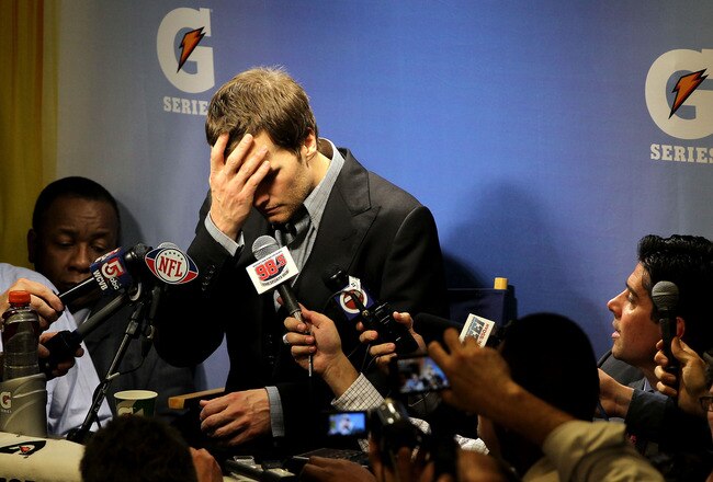 INDIANAPOLIS, IN - FEBRUARY 05:  Quarterback Tom Brady #12 of the New England Patriots speaks to the media after losing to the New York Giants in Super Bowl XLVI at Lucas Oil Stadium on February 5, 2012 in Indianapolis, Indiana. The New York Giants defeated the New England Patriots 21-17.  (Photo by Jamie Squire/Getty Images)