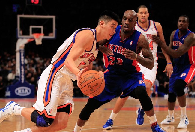 NEW YORK, NY - JANUARY 31:  Jeremy Lin #17 of the New York Knicks drives past Detroit Pistons Walker Russell #23 of the Detroit Pistons at Madison Square Garden on January 31, 2012 in New York City.  NOTE TO USER: User expressly acknowledges and agrees that, by downloading and or using this photograph, User is consenting to the terms and conditions of the Getty Images License Agreement. (Photo by Chris Trotman/Getty Images)