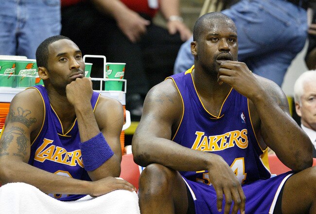 MINNEAPOLIS - MAY 23:  Kobe Bryant #8 and Shaquille O'Neal #34 of the Los Angeles Lakers look on in the second half of Game two of the Western Conference Finals against the Minnesota Timberwolves during the 2004 NBA Playoffs on May 23, 2004 at Target Center in Minneapolis, Minnesota.  NOTE TO USER: User expressly acknowledges and agrees that, by downloading and or using this photograph, User is consenting to the terms and conditions of the Getty Images License Agreement.  (Photo by Jed Jacobsohn/Getty Images)