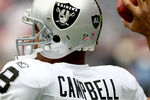 HOUSTON, TX - OCTOBER 09:  Quarterback Jason Campbell #8 of  the Oakland Raiders who is wearing a Black AL in the form of a Raider shield on the back of helmet warms up before playing against the Houston Texans on October 9, 2011 at Reliant Stadium in Houston, Texas. Raider owner, Al Davis died at age 82 at his home Saturday morning.(Photo by Thomas B. Shea/Getty Images)