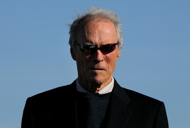 PEBBLE BEACH, CA - FEBRUARY 14:  Clint Eastwood waits on the 18th green to present the trophy during the final round of the AT&T Pebble Beach National Pro-Am at Pebble Beach Golf Links on February 14, 2010 in Pebble Beach, California. (Photo by Stephen Dunn/Getty Images)
