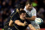 EDINBURGH, SCOTLAND - FEBRUARY 04:  Hooker Ross Ford of Scotland offloads the ball during the RBS Six Nations match between Scotland and England at Murrayfield Stadium on February 4, 2012 in Edinburgh, Scotland.  (Photo by David Rogers/Getty Images)