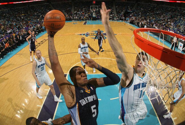 NEW ORLEANS, LA - JANUARY 18:  Marreese Speights #5 of the Memphis Grizzlies shoots the ball over Jason Smith #14 of the New Orleans Hornets at New Orleans Arena on January 18, 2012 in New Orleans, Louisiana.  NOTE TO USER: User expressly acknowledges and agrees that, by downloading and or using this photograph, User is consenting to the terms and conditions of the Getty Images License Agreement.  (Photo by Chris Graythen/Getty Images)