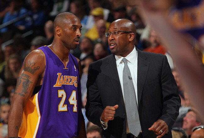 DENVER, CO - FEBRUARY 03:  Head coach Mike Brown talks with Kobe Bryant #24 of the Los Angeles Lakers during a break in the action against the Denver Nuggets at the Pepsi Center on February 3, 2012 in Denver, Colorado. NOTE TO USER: User expressly acknowledges and agrees that, by downloading and or using this photograph, User is consenting to the terms and conditions of the Getty Images License Agreement.  (Photo by Doug Pensinger/Getty Images)