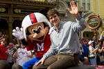 LAKE BUENA VISTA, FL - FEBRUARY 6:   In this handout image provided by Disney Parks, Super Bowl XLVI MVP and New York Giants quarterback Eli Manning takes a celebratory ride with Mickey Mouse on February 6, 2012 at the Magic Kingdom at Walt Disney World Resort in Lake Buena Vista, Florida.  The celebration at the theme park took place only one day after Manning led his team to a 21-17 victory over the New England Patriots in Super Bowl XLVI in Indianapolis.  Immediately following the game, Manning looked into TV cameras and shouted 'I'm Going to Disney World!'  He is the latest star in the famous Disney commercial series. (Photo by Matt Stroshane/Disney Parks via Getty Images)