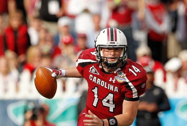 ORLANDO, FL - JANUARY 02:  Connor Shaw #14 of the South Carolina Gamecocks rushes during the Capitol One Bowl against the Nebraska Cornhuskers at Florida Citrus Bowl on January 2, 2012 in Orlando, Florida.  (Photo by Mike Ehrmann/Getty Images)