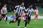 UDINE, ITALY - OCTOBER 20:  Medhi Benatia of Udinese celebrates with Pablo Armero (R) after scoring the opening goal during the UEFA Europa League group I match between Udinese Calcio and Club Atletico de Madrid at Stadio Friuli on October 20, 2011 in Udine, Italy.  (Photo by Dino Panato/Getty Images)
