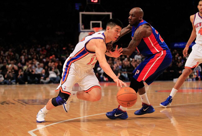 NEW YORK, NY - JANUARY 31:  Jeremy Lin #17 of the New York Knicks drives past Detroit Pistons Walker Russell #23 of the Detroit Pistons at Madison Square Garden on January 31, 2012 in New York City.  NOTE TO USER: User expressly acknowledges and agrees that, by downloading and or using this photograph, User is consenting to the terms and conditions of the Getty Images License Agreement. (Photo by Chris Trotman/Getty Images)