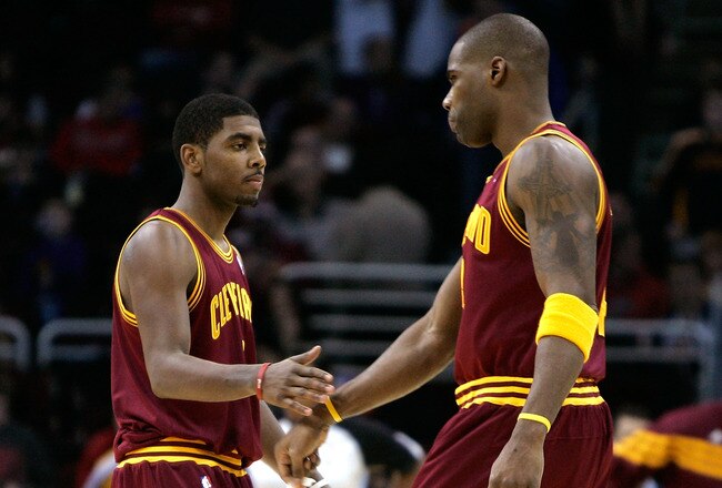CLEVELAND, OH - DECEMBER 26:  Kyrie Irving #2 and Antawn Jamison #4 of the Cleveland Cavaliers react after a play against the Toronto Raptors during the season opener at Quicken Loans Arena on December 26, 2011 in Cleveland, Ohio. NOTE TO USER: User expressly acknowledges and agrees that, by downloading and or using this photograph, User is consenting to the terms and conditions of the Getty Images License Agreement.  (Photo by Mike Lawrie/Getty Images)