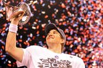 INDIANAPOLIS, IN - FEBRUARY 05:  Quarterback Eli Manning #10 of the New York Giants poses with the Vince Lombardi Trophy after the Giants defeated the Patriots by a score of 21-17 in Super Bowl XLVI at Lucas Oil Stadium on February 5, 2012 in Indianapolis, Indiana.  (Photo by Ezra Shaw/Getty Images)