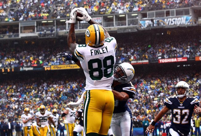 SAN DIEGO, CA - NOVEMBER 6:  Tight end Jermichael Finley #88 of the Green Bay Packers catches the ball for a touchdown as Steve Gregory #28 and Eric Weddle #32 of the San Diego Chargers look on, on November 6, 2011 at Qualcomm Stadium in San Diego, California.  (Photo by Donald Miralle/Getty Images)