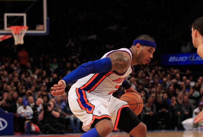 NEW YORK, NY - JANUARY 31:  Carmelo Anthony #7 of the New York Knicks drives against Austin Daye #5 of the Detroit Pistons at Madison Square Garden on January 31, 2012 in New York City.  NOTE TO USER: User expressly acknowledges and agrees that, by downloading and or using this photograph, User is consenting to the terms and conditions of the Getty Images License Agreement. (Photo by Chris Trotman/Getty Images)