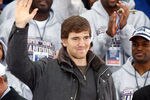 NEW YORK - FEBRUARY 05:  Quarterback Eli Manning waves to the crowd during the New York Giants Super Bowl XLII victory parade reception at City Hall February 5, 2008 in New York City.  (Photo by Nick Laham/Getty Images)