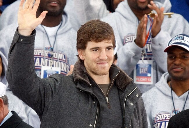 NEW YORK - FEBRUARY 05:  Quarterback Eli Manning waves to the crowd during the New York Giants Super Bowl XLII victory parade reception at City Hall February 5, 2008 in New York City.  (Photo by Nick Laham/Getty Images)