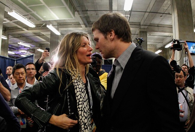 INDIANAPOLIS, IN - FEBRUARY 05:  Tom Brady #12 of the New England Patriots chats with his wife Gisele Bundchen after losing to the New York Giants by a score of 21-17 in Super Bowl XLVI at Lucas Oil Stadium on February 5, 2012 in Indianapolis, Indiana.  (Photo by Rob Carr/Getty Images)
