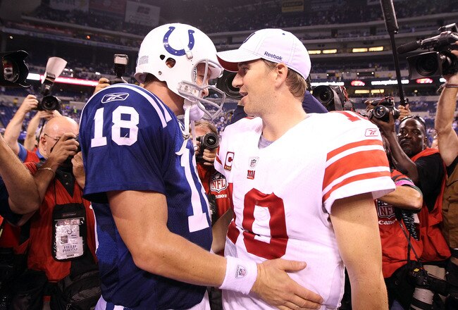 INDIANAPOLIS - SEPTEMBER 19:  Eli Manning #10 of the New York Giants and Peyton Manning #18 of the Indianapolis Colts embrace following the Colts 38-14 win at Lucas Oil Stadium on September 19, 2010 in Indianapolis, Indiana.  (Photo by Andy Lyons/Getty Images)