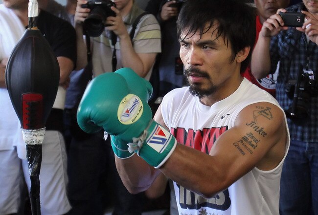 HOLLYWOOD, CA - APRIL 20:  Manny Pacquiao of the Philippines trains on the speed bag during a media workout at the Wild Card Boxing Club on April 20, 2011 in Hollywood, California.  (Photo by Jeff Gross/Getty Images)