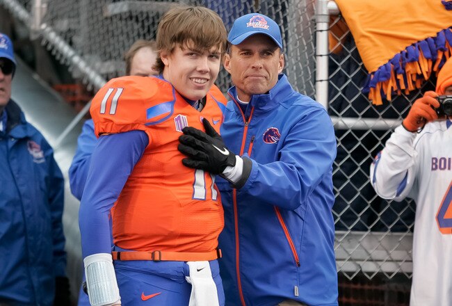BOISE, ID - DECEMBER 03: Head Coach Chris Petersen congratulates Kellen Moore #11 of the Boise State Broncos before his Senior Day introduction before the game against the New Mexico Lobos at Bronco Stadium on December 3, 2011 in Boise, Idaho.  (Photo by Otto Kitsinger III/Getty Images)