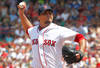 BOSTON, MA  - JULY 28:  Josh Beckett #19 of the Boston Red Sox throws against the Kansas City Royals at Fenway Park on July 28, 2011 in Boston, Massachusetts.  (Photo by Jim Rogash/Getty Images)