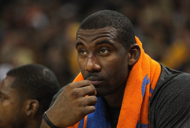 OAKLAND, CA - DECEMBER 28:  Amare Stoudemire #1 of the New York Knicks sits on the bench during their game against the Golden State Warriors at Oracle Arena on December 28, 2011 in Oakland, California.  NOTE TO USER: User expressly acknowledges and agrees that, by downloading and or using this photograph, User is consenting to the terms and conditions of the Getty Images License Agreement.  (Photo by Ezra Shaw/Getty Images)