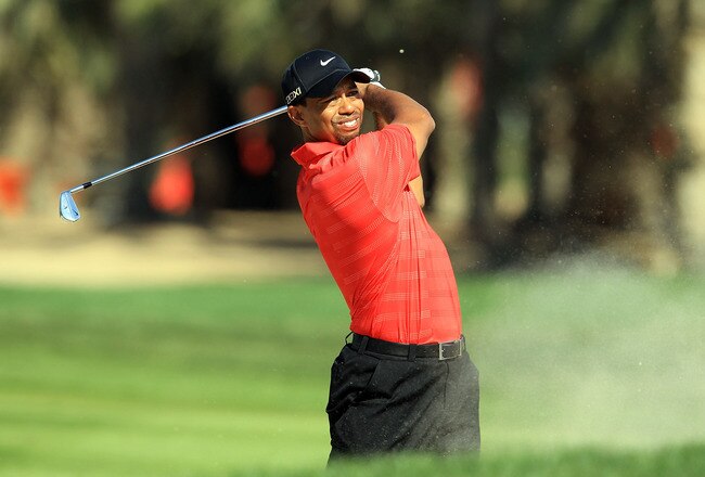 ABU DHABI, UNITED ARAB EMIRATES - JANUARY 29:  Tiger Woods of the USA plays his second shot on the par 5, 10th hole during the final round of the Abu Dhabi HSBC Championship at the Abu Dhabi Golf Club on January 29, 2012 in Abu Dhabi, United Arab Emirates.  (Photo by David Cannon/Getty Images)