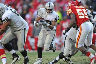KANSAS CITY, MO - DECEMBER 24:  Running back Michael Bush #29 of the Oakland Raiders rushes up field against the Kansas City Chiefs during overtime on December 24, 2011 at Arrowhead Stadium in Kansas City, Missouri.  Oakland defeated Kansas City 16-13 in overtime.  (Photo by Peter Aiken/Getty Images)