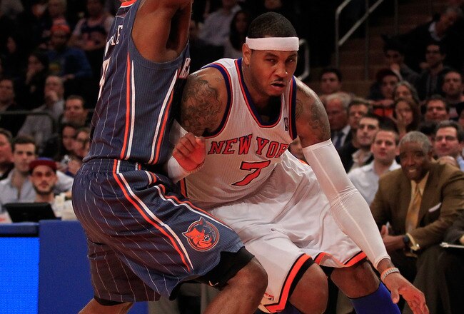 NEW YORK, NY - JANUARY 09: (R) Carmelo Anthony #7 of the New York Knicks drives against (R) D.J. White #8 of the Charlotte Bobcats at Madison Square Garden on January 9, 2012 in New York City. NOTE TO USER: User expressly acknowledges and agrees that, by downloading and or using this photograph, User is consenting to the terms and conditions of the Getty Images License Agreement.  (Photo by Chris Trotman/Getty Images)