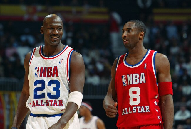 ATLANTA - FEBRUARY 9:  Michael Jordan (Washington Wizards) #23 of the Eastern Conference All-Stars talks with Kobe Bryant (Los Angeles Lakers) #8 of the Western Conference All-Stars at the 2003 NBA All-Star Game on February 9, 2003 at Philips Arena in Atlanta, Georgia.  NOTE TO USER:  User expressly acknowledges and agrees that, by downloading and or using this photograph, user is consenting to the terms and conditions of the Getty Images license agreement. (Photo by Jamie Squire/Getty Images)