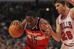 CHICAGO, IL - JANUARY 11: Jordan Crawford #15 of the Washington Wizards drives against Kyle Korver #26 of the Chicago Bulls at the United Center on January 11, 2012 in Chicago, Illinois. The Bulls defeated the Wizards 78-64. NOTE TO USER: User expressly acknowledges and agrees that, by downloading and or using this photograph, User is consenting to the terms and conditions of the Getty Images License Agreement.  (Photo by Jonathan Daniel/Getty Images)