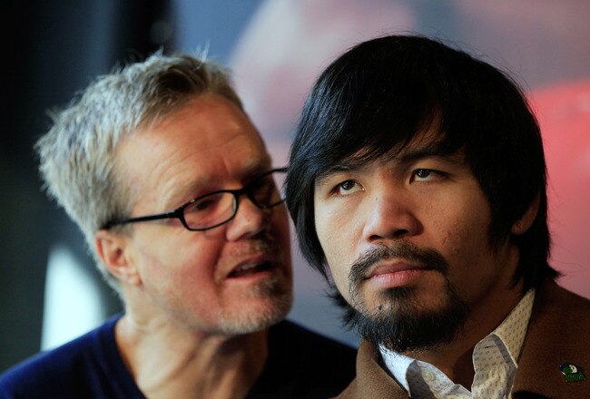 NEW YORK, NY - FEBRUARY 14: (L) Trainer Freddie Roach talks to his boxer (R) Manny Pacquiao at a press conference to promote the fight with Shane Mosley at The Lighthouse at Chelsea Piers on February 14, 2011 in New York City.  (Photo by Chris Trotman/Getty Images)