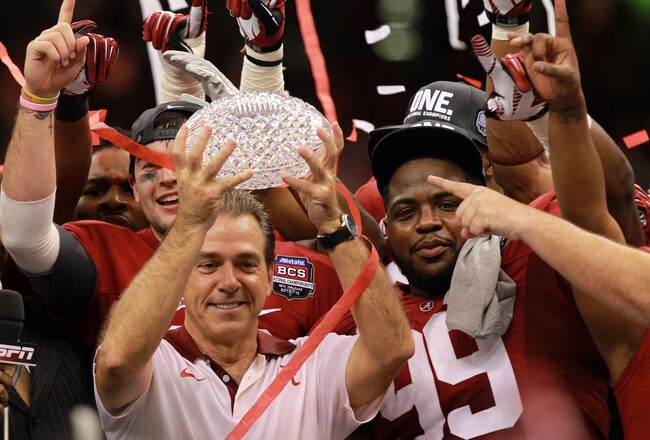 NEW ORLEANS, LA - JANUARY 09:  Head coach Nick Saban of the Alabama Crimson Tide celebrates with the trophy after defeating Louisiana State University Tigers in the 2012 Allstate BCS National Championship Game at Mercedes-Benz Superdome on January 9, 2012 in New Orleans, Louisiana.  (Photo by Ronald Martinez/Getty Images)