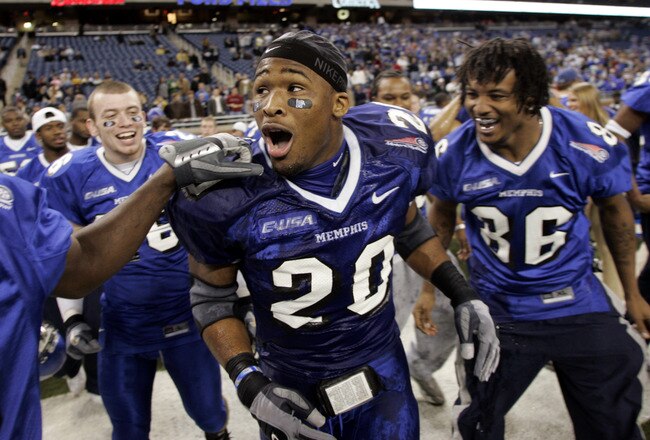 Memphis Tigers DeAngelo Williams #20 is congradulated by teammates after thier 38-31 victory over the Akron Zips at the Motor City Bowl at Ford Field in Detroit, Michigan on December 26, 2005. (Photo by Gregory Shamus/Getty Images)