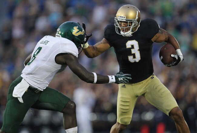SOUTH BEND, IN - SEPTEMBER 03: Michael Floyd #3 of the Notre Dame Fighting Irish fights off  Jon Lejiste #8 of the University of South Florida Bulls at Notre Dame Stadium on September 3, 2011 in South Bend, Indiana. (Photo by Jonathan Daniel/Getty Images)
