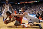 LEXINGTON, KY - JANUARY 21: Michael Porter #13 of the Kentucky Wildcats dives for the ball controlled by Frankie Sullivan #20 of the Auburn Tigers during the SEC game at Rupp Arena on January 21, 2009 in Lexington, Kentucky. Kentucky won 73-64.  (Photo by Andy Lyons/Getty Images)