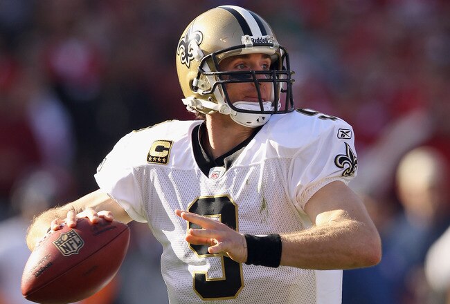 SAN FRANCISCO, CA - JANUARY 14:  Drew Brees #9 of the New Orleans Saints looks to pass from the pocket against the San Francisco 49ers during the NFC Divisional playoff game at Candlestick Park on January 14, 2012 in San Francisco, California. The 49ers won the game 36-32. (Photo by Ezra Shaw/Getty Images)
