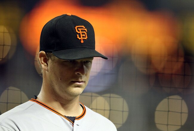 PHOENIX, AZ - SEPTEMBER 23:  Starting pitcher Matt Cain #18 of the San Francisco Giants walks back to the dugout during the Major League Baseball game against the Arizona Diamondbacks at Chase Field on September 23, 2011 in Phoenix, Arizona.  (Photo by Christian Petersen/Getty Images)
