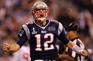 INDIANAPOLIS, IN - FEBRUARY 05:  Quarterback Tom Brady #12 of the New England Patriots reacts after throwing a 12 yard touchdown pass to Aaron Hernandez #81 against the New York Giants during Super Bowl XLVI at Lucas Oil Stadium on February 5, 2012 in Indianapolis, Indiana.  (Photo by Ezra Shaw/Getty Images)