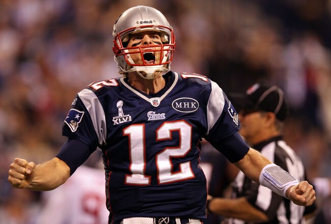 INDIANAPOLIS, IN - FEBRUARY 05:  Quarterback Tom Brady #12 of the New England Patriots reacts after throwing a 12 yard touchdown pass to Aaron Hernandez #81 against the New York Giants during Super Bowl XLVI at Lucas Oil Stadium on February 5, 2012 in Indianapolis, Indiana.  (Photo by Ezra Shaw/Getty Images)