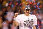 INDIANAPOLIS, IN - FEBRUARY 05:  Quarterback Eli Manning #10 of the New York Giants smiles after the Giants defeated the Patriots by a score of 21-17 in Super Bowl XLVI at Lucas Oil Stadium on February 5, 2012 in Indianapolis, Indiana.  (Photo by Rob Carr/Getty Images)